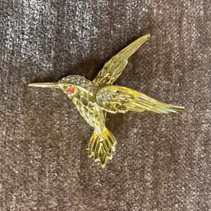 Hummingbird gold toned pin brooch pink eye rhinestone detail